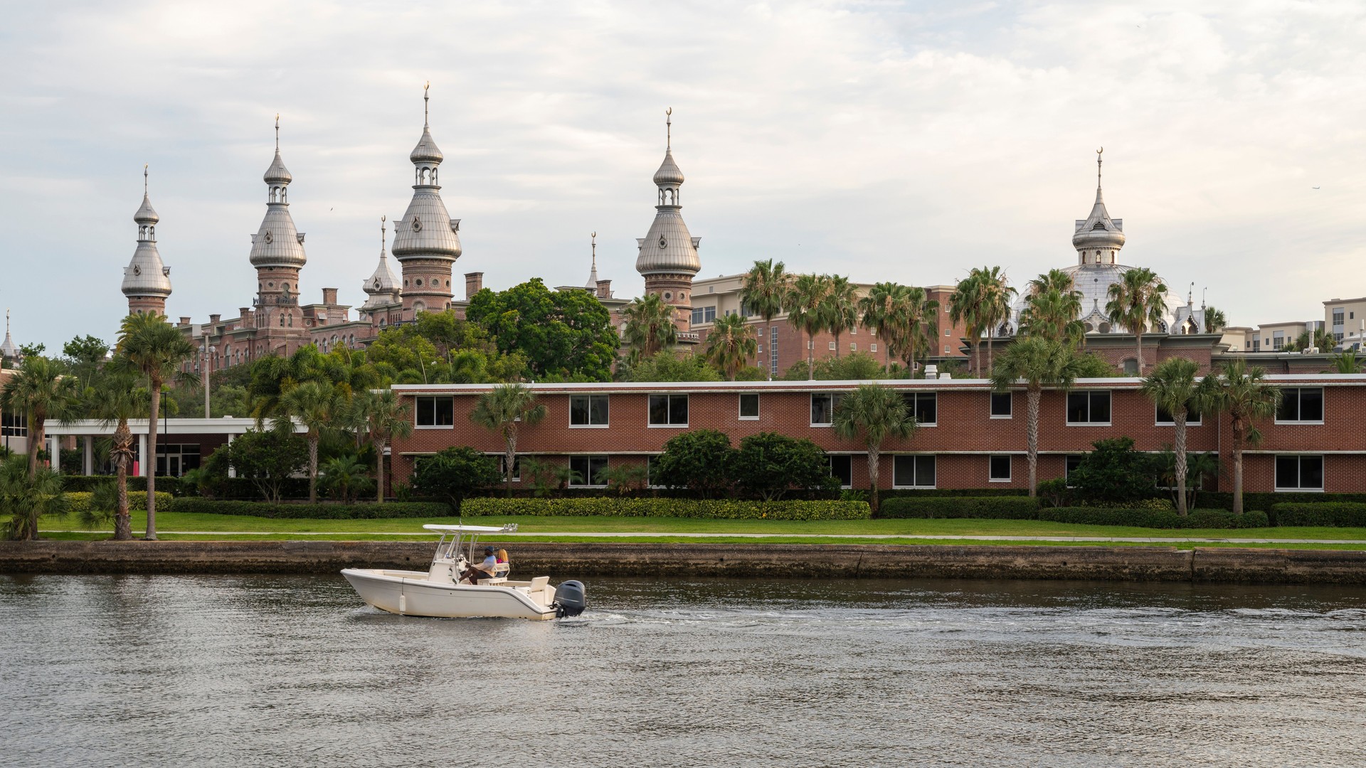 Aerial view of the University of Tampa from the side of the Hillsborough River on a summer day.